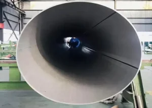 Interior view of a large ASTM A790 stainless steel pipe.